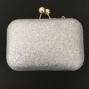 Clutch bag/ party clutch. Silver in gold tone. New